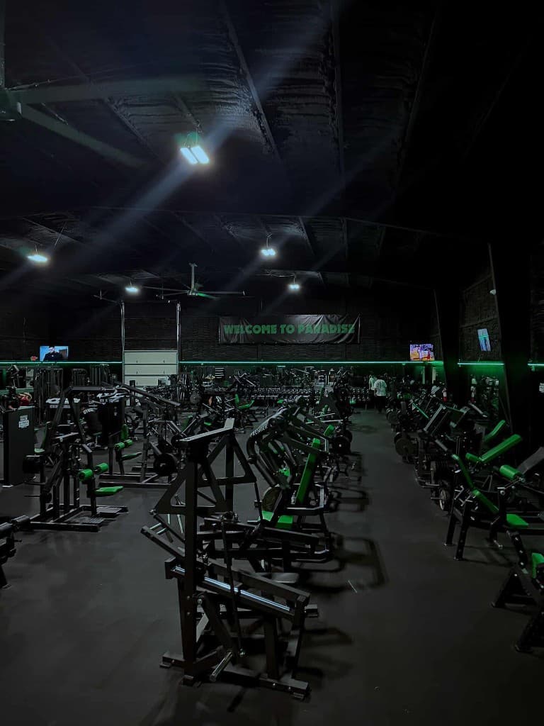 Wide view of Paradise Gym showing the full weight room layout